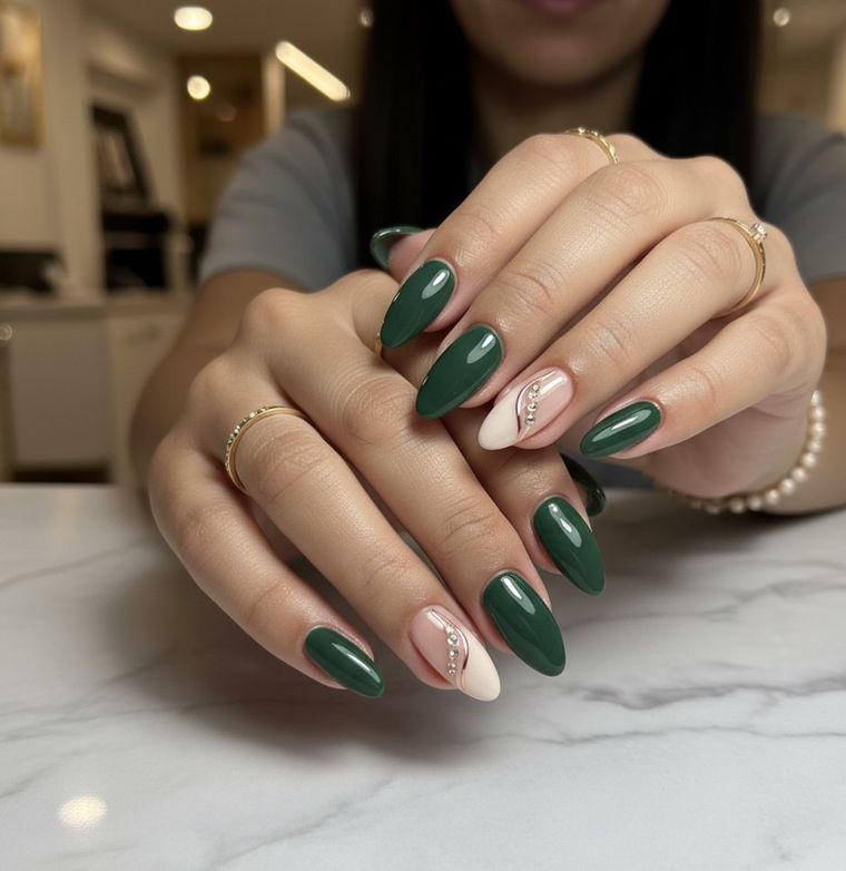 Deep forest green almond nails with a nude swirl accent nail set with crystals